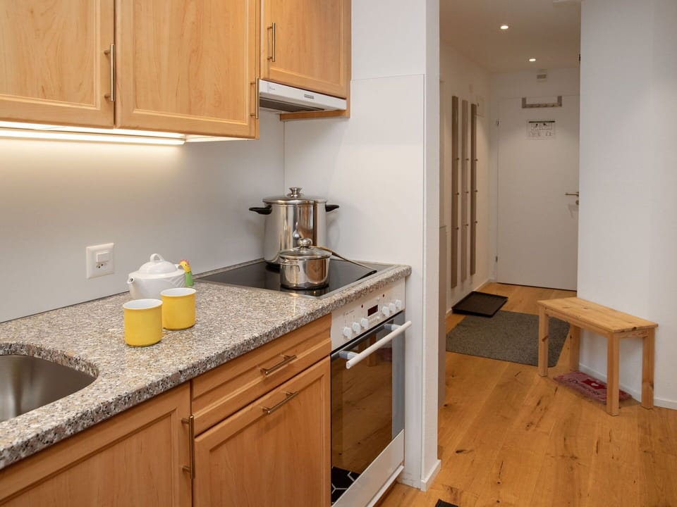 Furniture, Kitchen Appliance, Kitchen, Flooring, Interior Design, Countertop, Major Appliance, Floor, Wood, Cabinetry