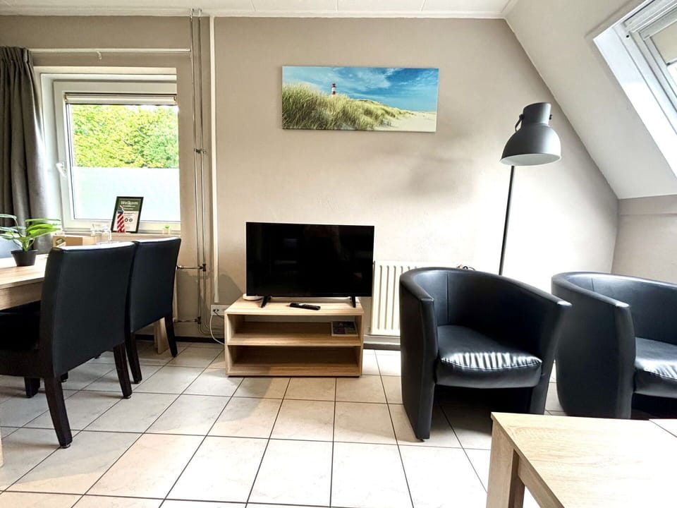 Furniture, Interior Design, Flooring, Floor, Room, Picture Frame, Table, Chair, Lighting