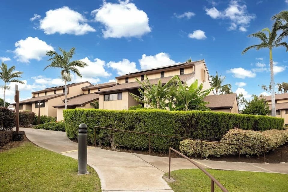 Lush landscaped pathway leading to the unit, offering a warm and tropical welcome