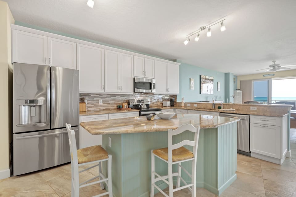 Open and Bright Kitchen with Stainless Steel Appliances.