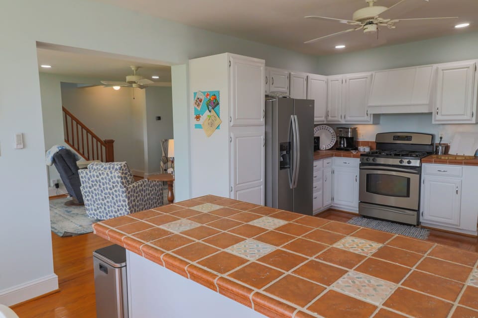 Fully stocked kitchen with gas oven and stove