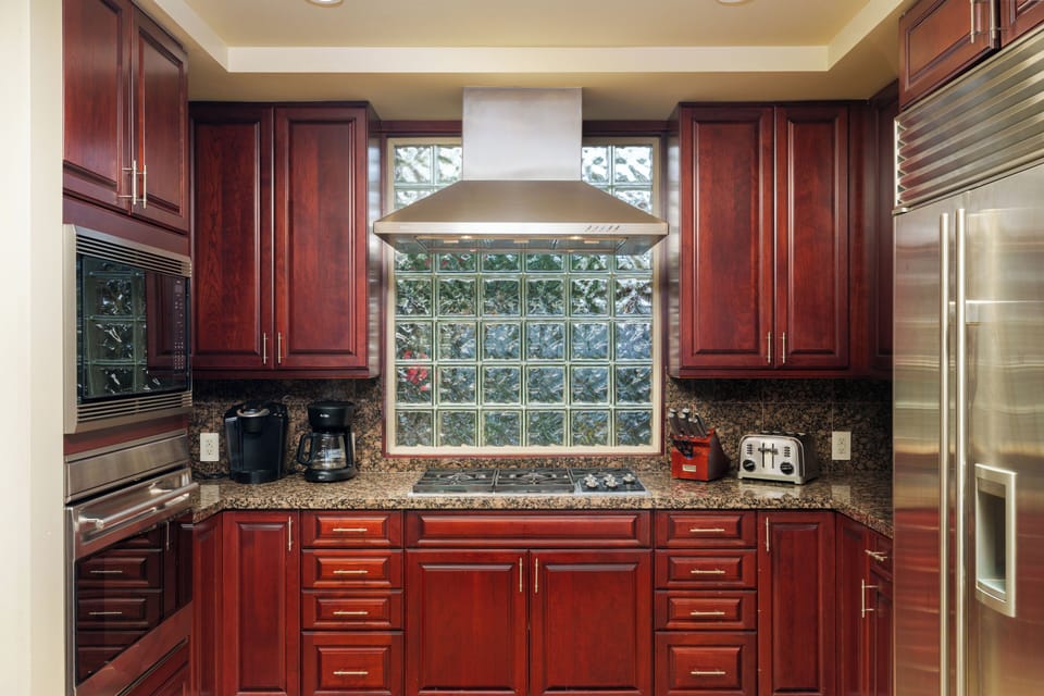 Large kitchen with Subzero refrigerator, Wolfe oven, microwave, and range
