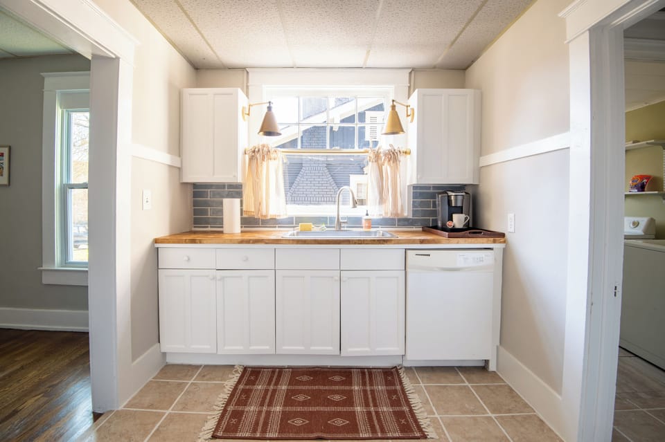 Modern kitchen with stainless steel appliances and sleek countertops.