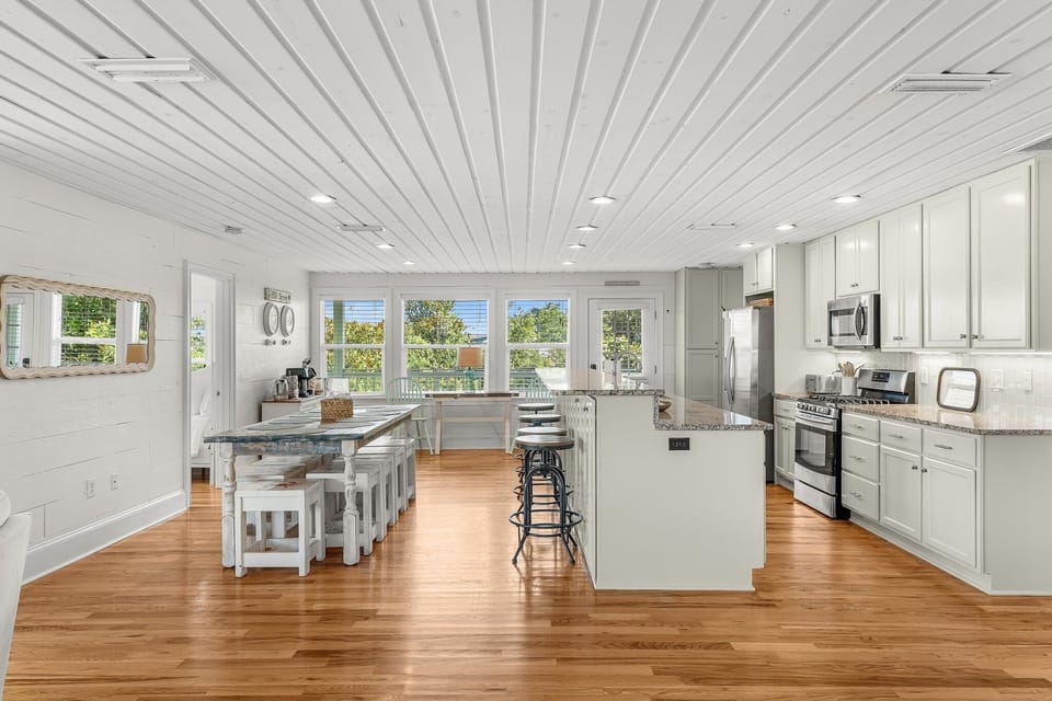 HUGE kitchen and dining area with seating for 10 + 4 bar stools