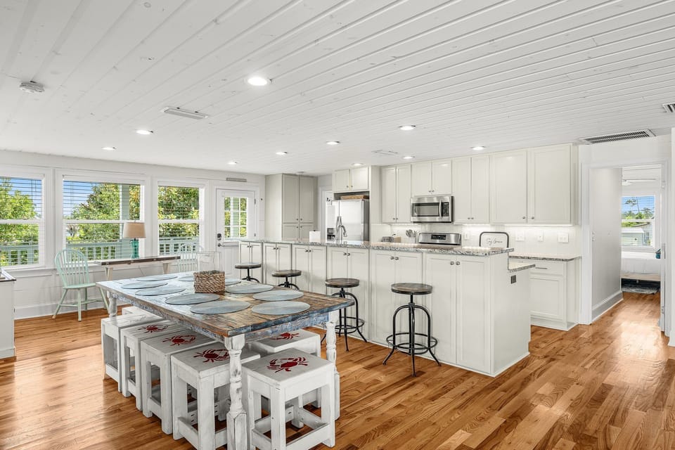 Seating for 10, bar stools, tons of storage and a loaded kitchen