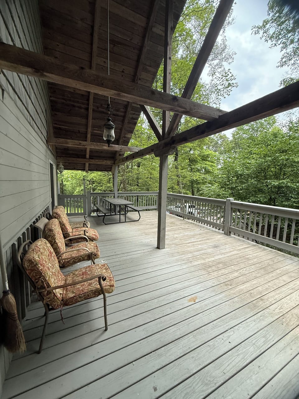 Wooden deck area for your morning coffee, outdoor meals, or simply hanging out!