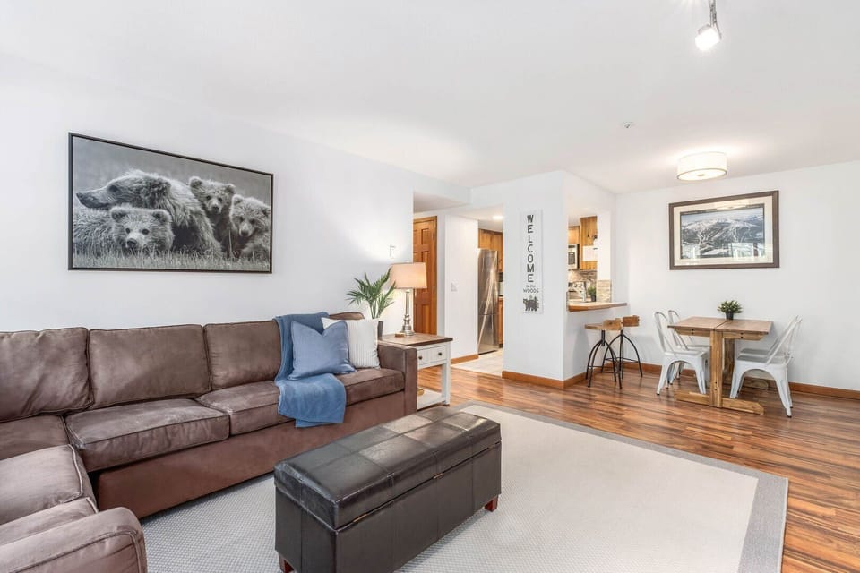 The living room flows seamlessly into the kitchen and dining area.
