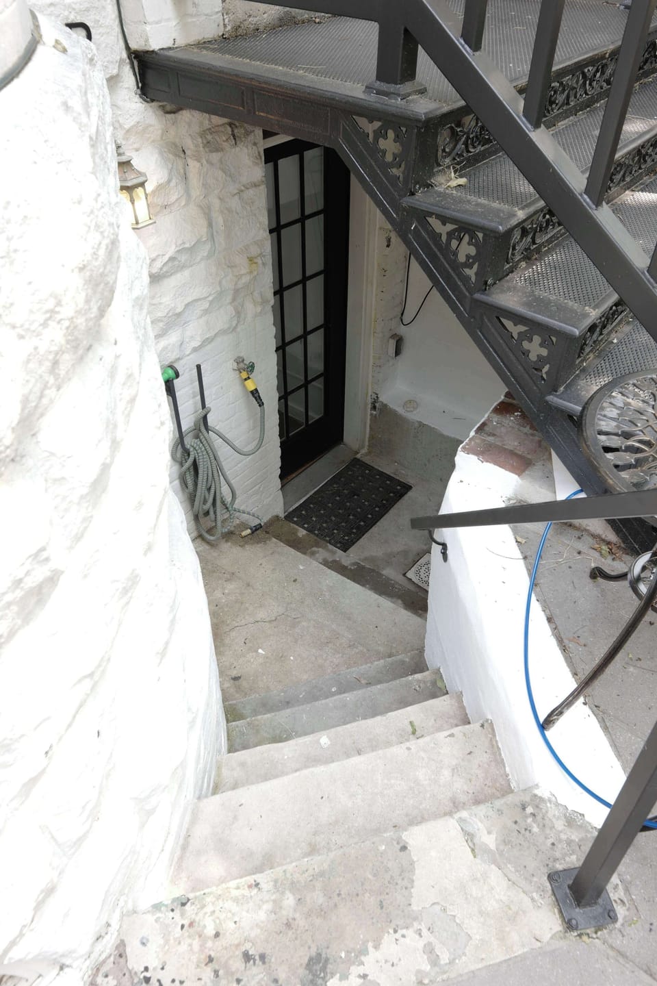 Step down these stairs to the entrance of the unit!