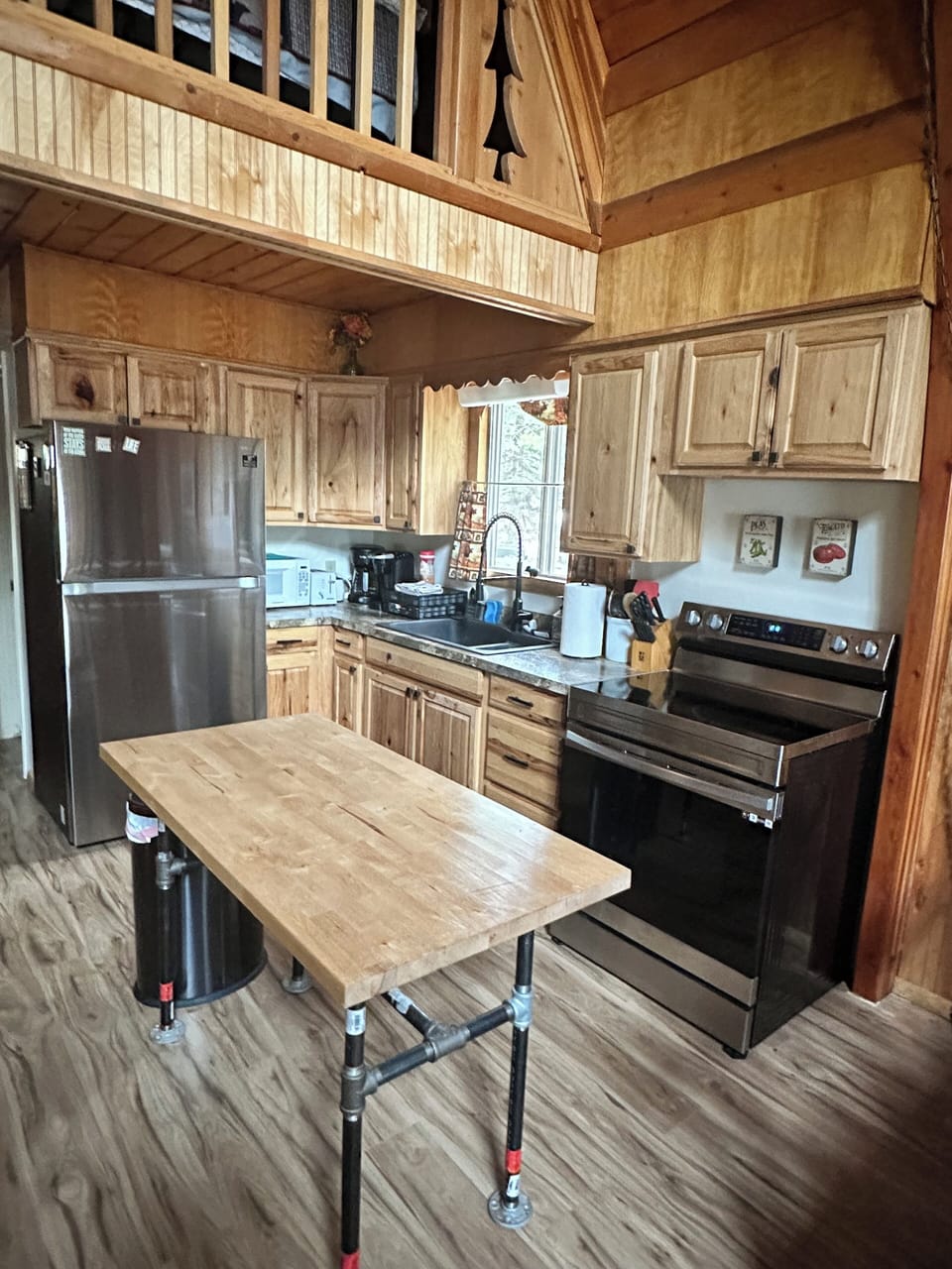 Kitchen with new appliances and useful island table