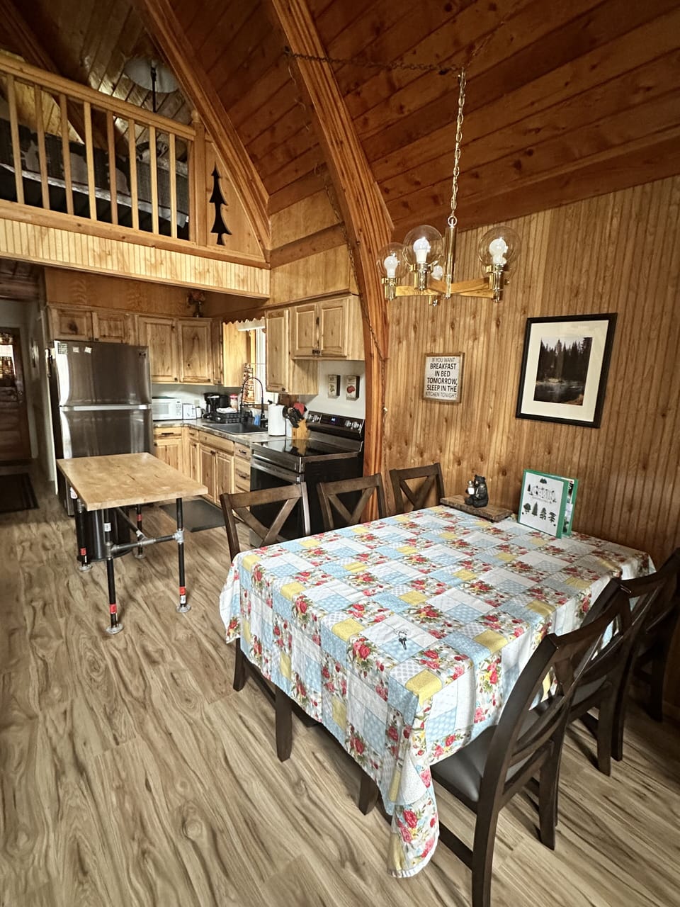 Bigger view of dinner table and kitchen area