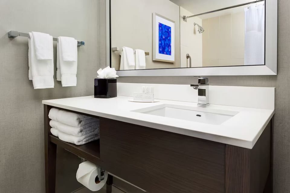 Refresh with a bright vanity and fluffy, spa-like towels.