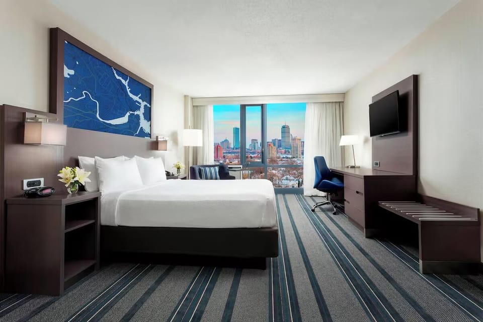 Unwind in crisp linens with sweeping city views.