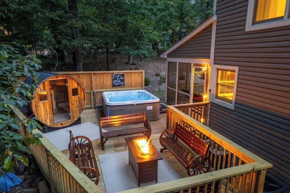 Deck with hot tub, sauna, and propane firetable / seating area