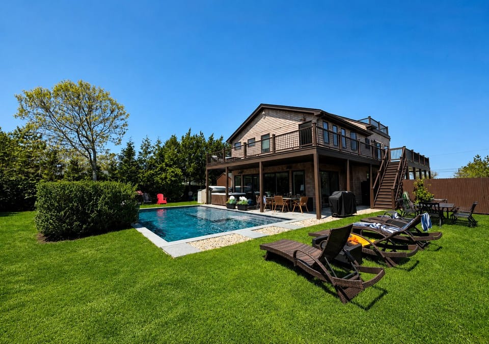 Backyard view overlooking the saltwater pool and rear of the property!