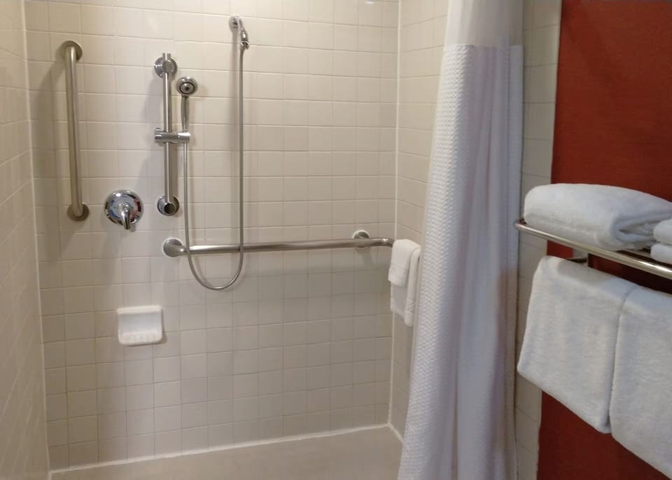 Rinse off in a clean shower with supportive grab bars.