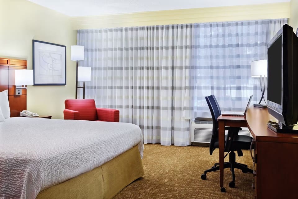 Enjoy a restful night with workspace and window-side seating.