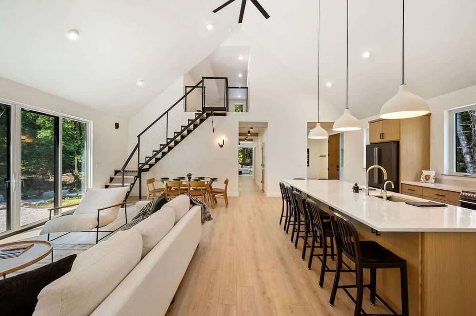  DoCo Abode is a newly built 3-bedroom, 2.5-bathroom retreat that combines impeccable design with high-end finishes. Located just one mile from downtown Egg Harbor, this home offers the perfect balance of seclusion and convenience, making it an ideal