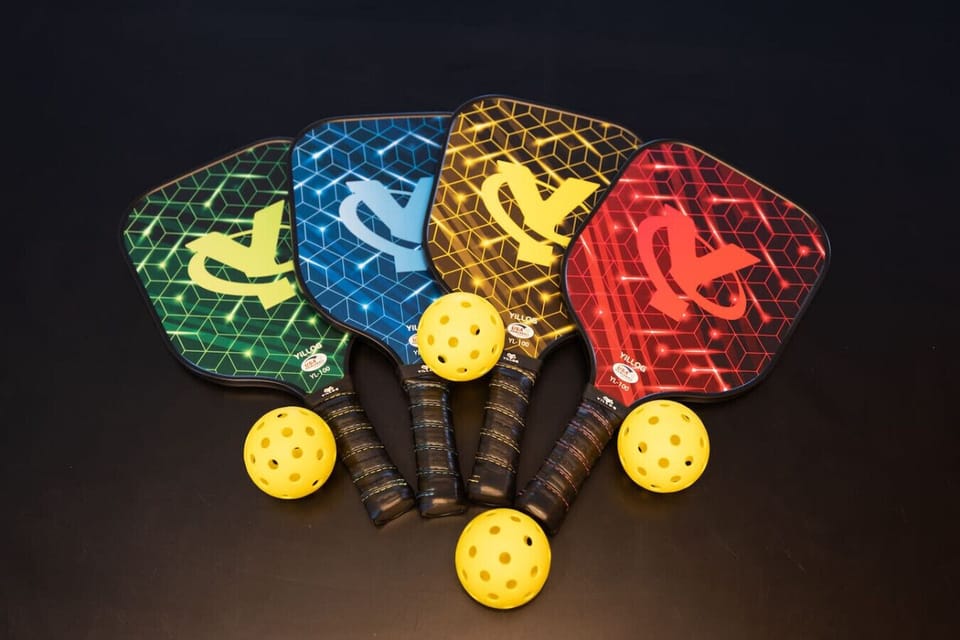 Pickleball paddles and balls set, ready for friendly matches