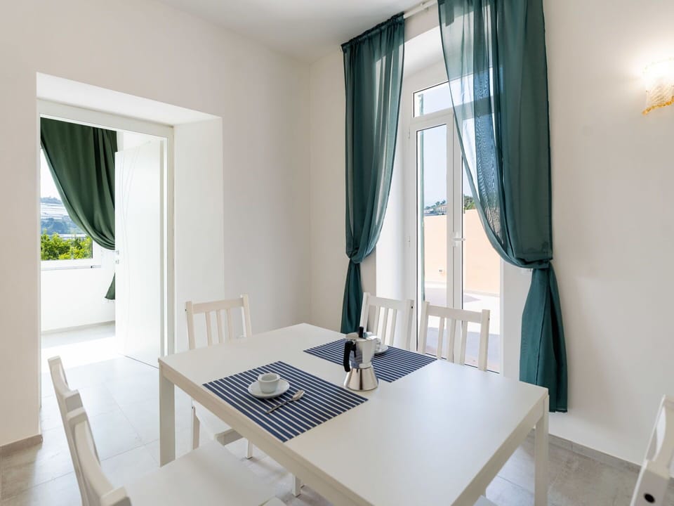 Furniture, Chair, Outdoor Furniture, Table, Outdoor Table, Kitchen & Dining Room Table, Umbrella, Shade, Restaurant, Patio
