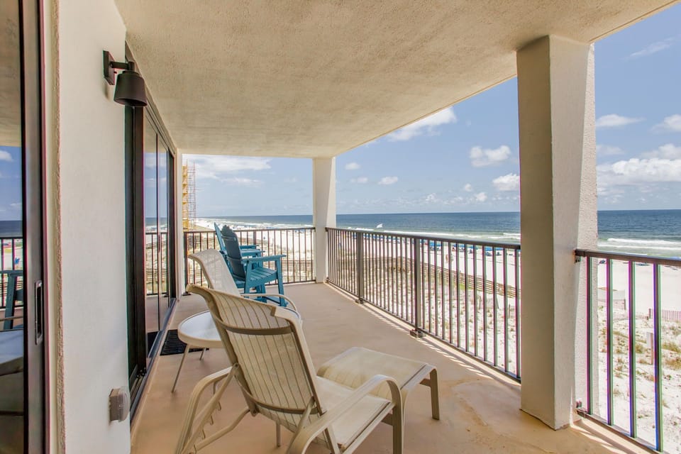 Covered balcony with panoramic Gulf views perfect for dolphin watching at Wind Drift