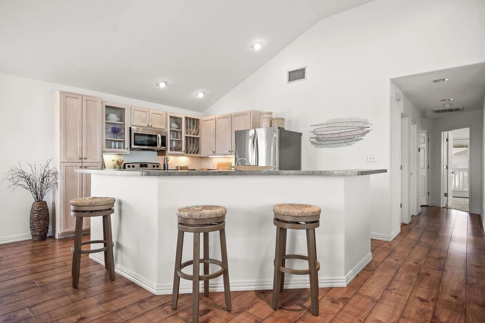 The airy, open kitchen offers ample space & every home comfort