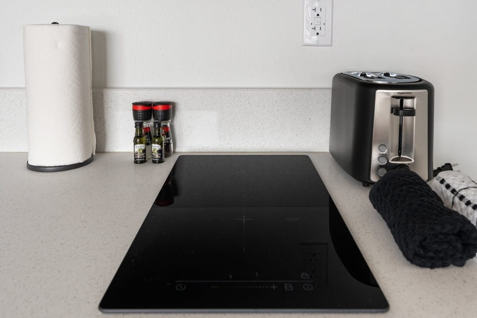 Cook up a meal on the induction cooktop, with cookware included for your use.