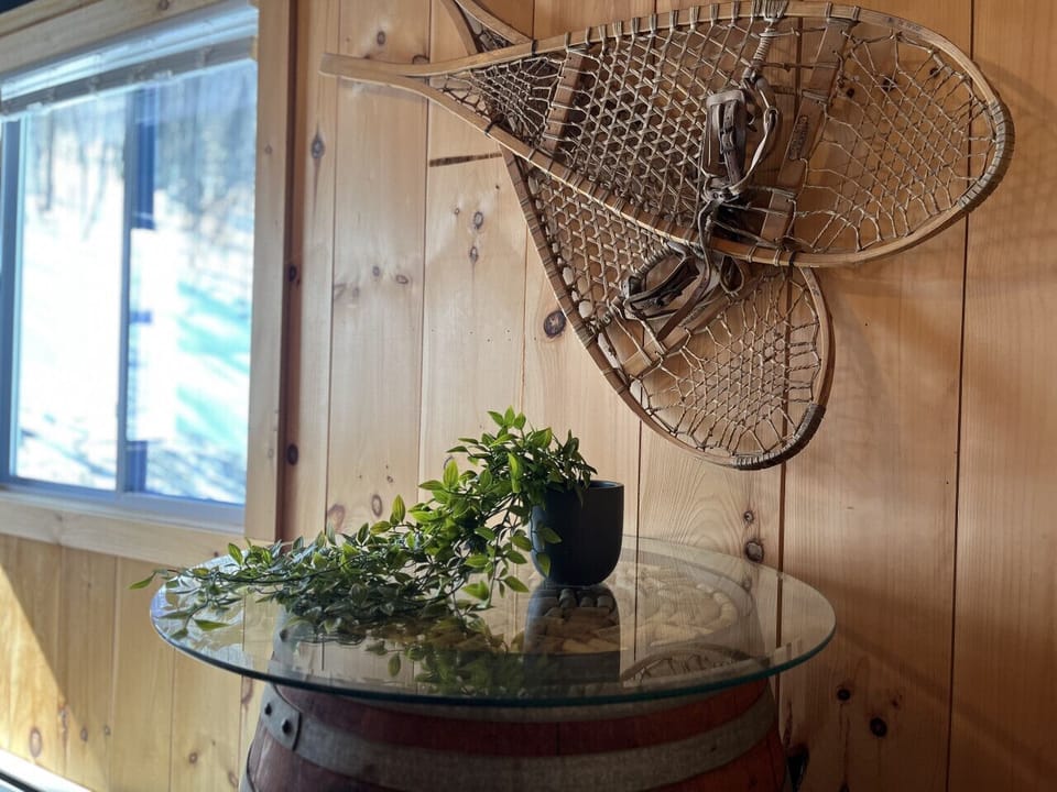 A peaceful corner featuring timeless snowshoes.