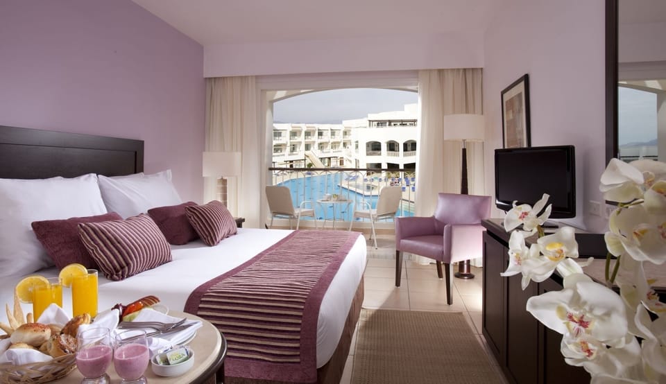 Wake up to sunshine and balcony views over the pool.