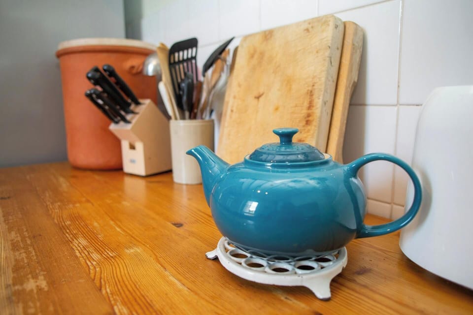Kitchen with chopping boards and cooking utensils