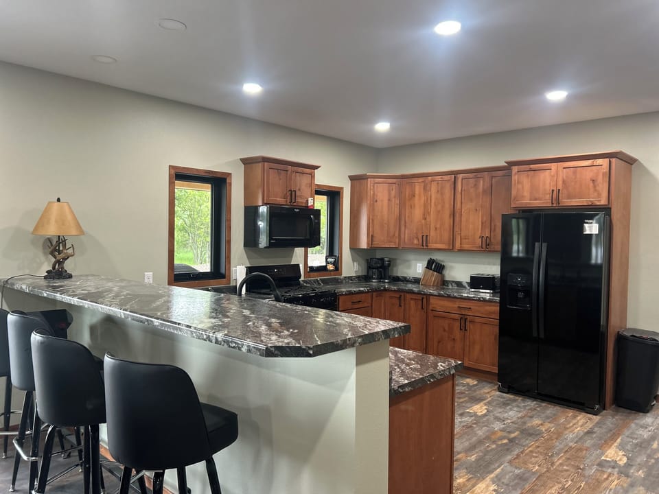 Kitchen with pull up stools to the bar
