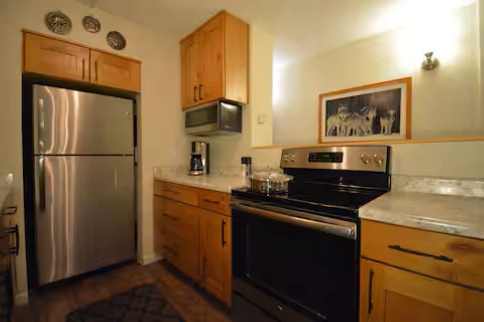 Kitchen with stove, oven, microwave and Coffee maker.