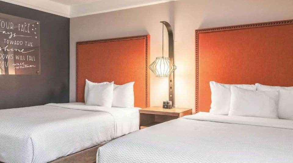 Sink into plush pillows between warm, modern headboards.