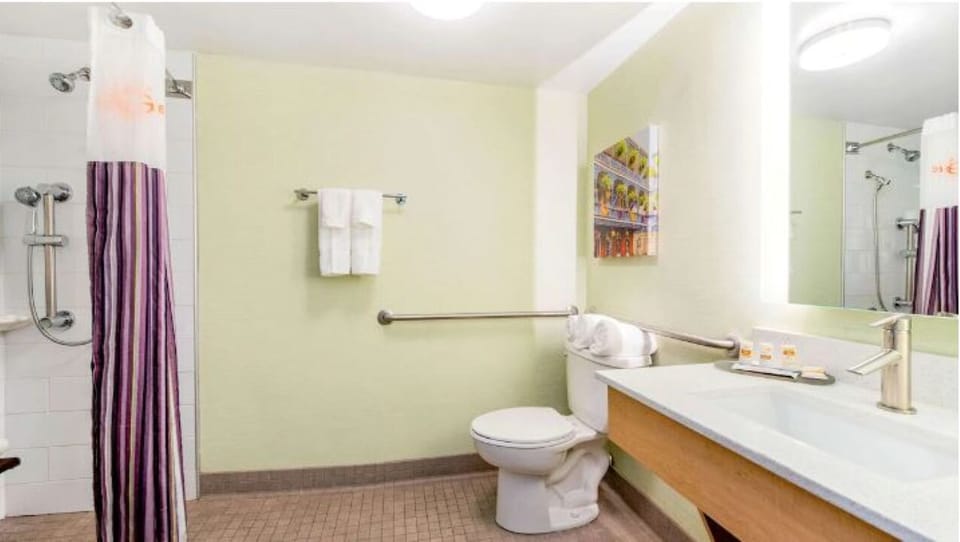 Rinse off comfortably with an easy-access shower and vanity.