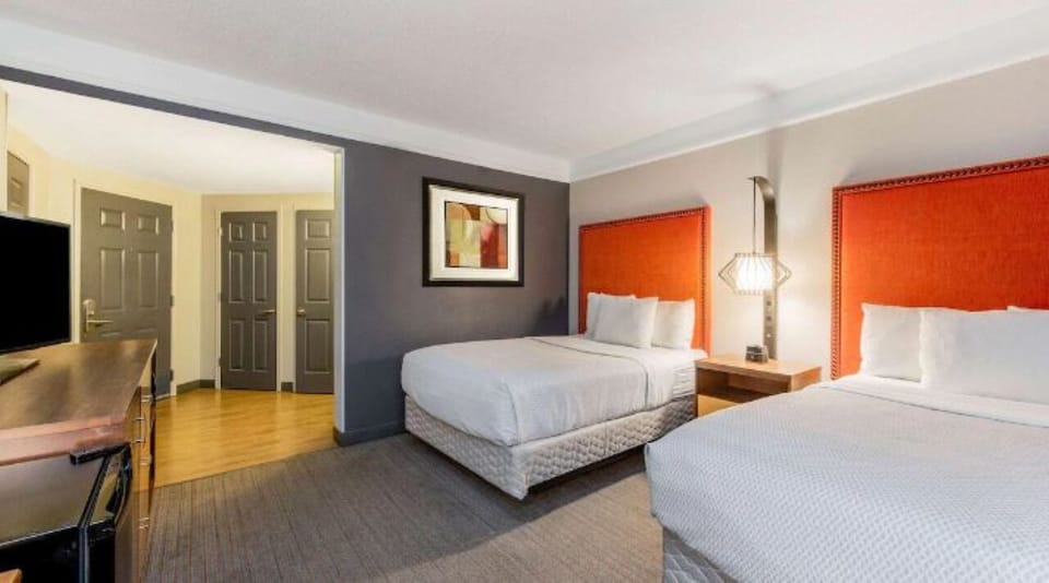 Settle into crisp bedding and a calm, spacious room.