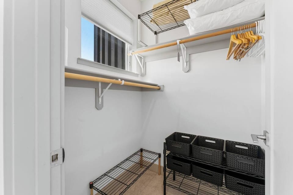 Master bedroom closet with lots of space for your things.