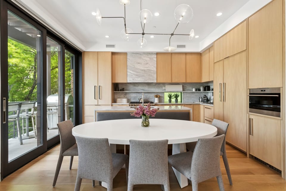 a large dining area next to the gourmet kitchen