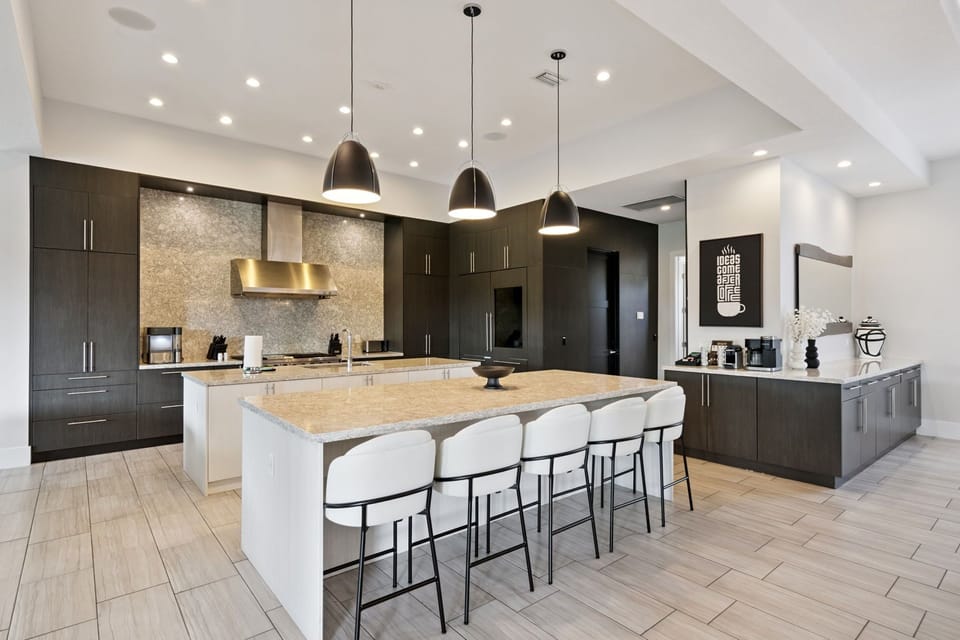 Chef's Kitchen with dual oven and range, dual microwave, dual dishwasher oversized refrigerator, pantry and ample storage