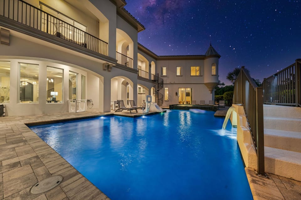 Charming bridge and fountain features with in-pool seating