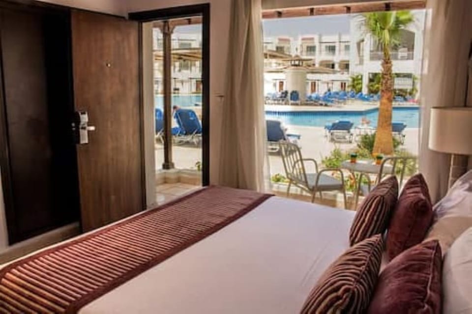 Step outside and enjoy poolside views from your room.