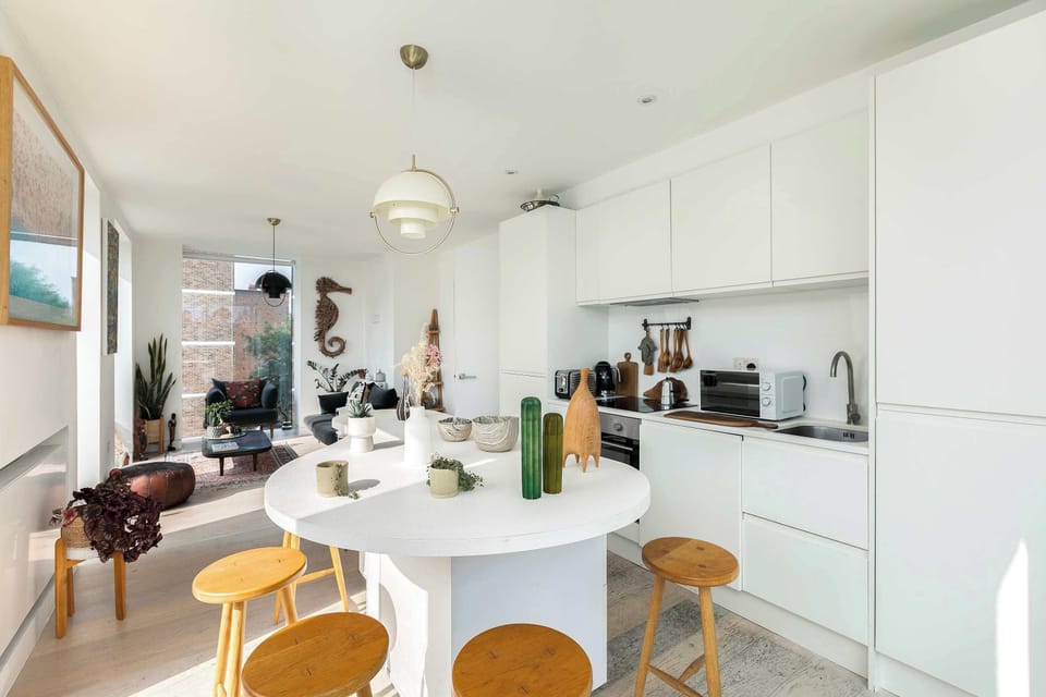 The heart of the home—a beautifully designed open-plan kitchen and dining area, perfect for cooking, dining and spending quality time together