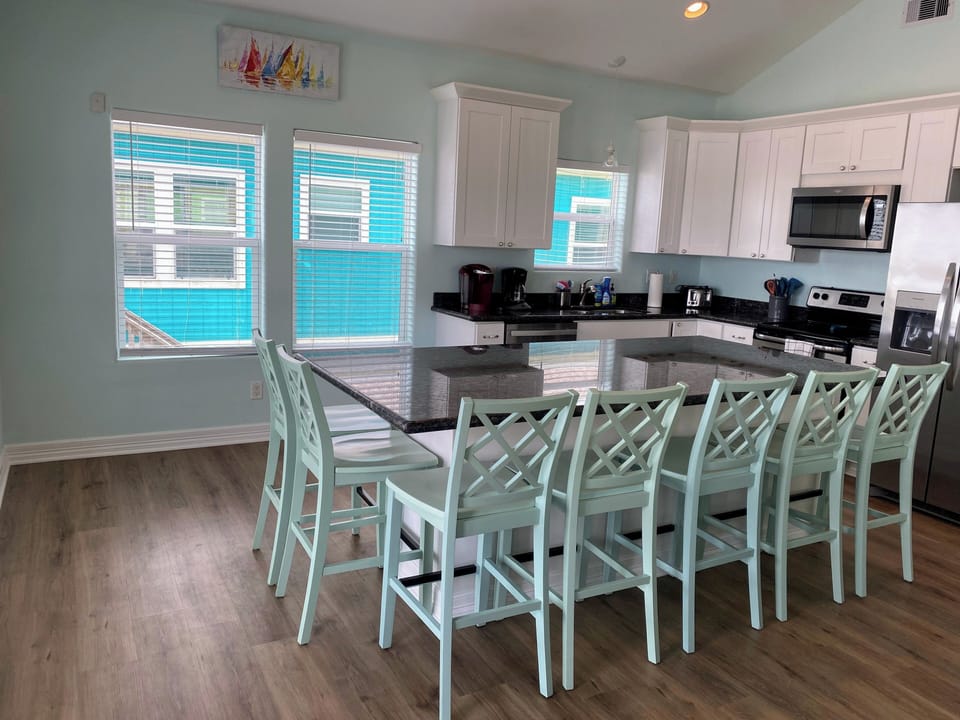 Open kitchen and living with full ocean view from every seat