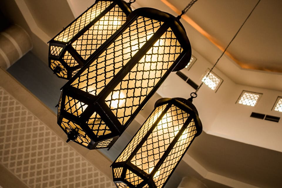 Bask under glowing lanterns for a serene evening ambiance.