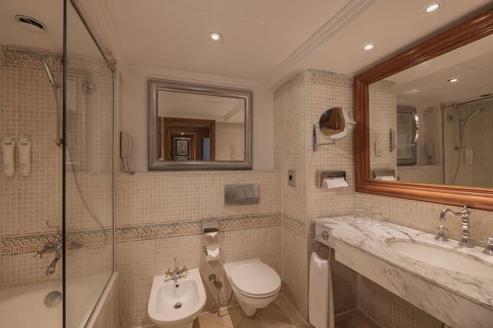 Start your evening with a rainfall shower in sparkling tile.