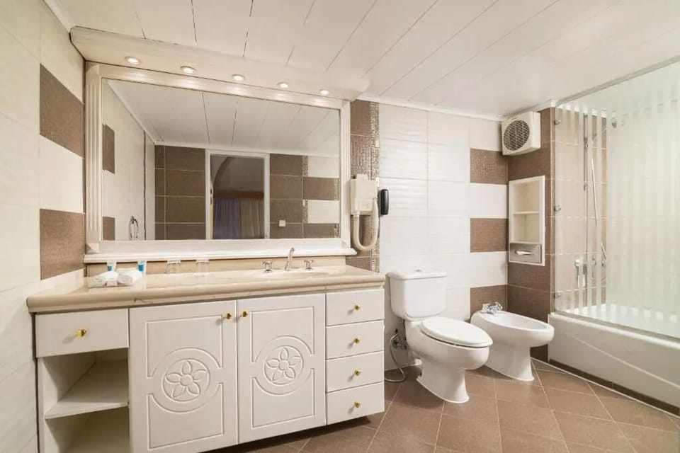 Indulge in a relaxing soak with generous vanity space.