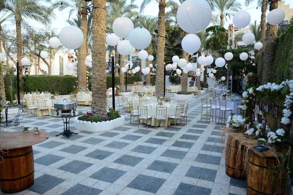 Celebrate magical evenings in a lantern-lit courtyard under palm trees