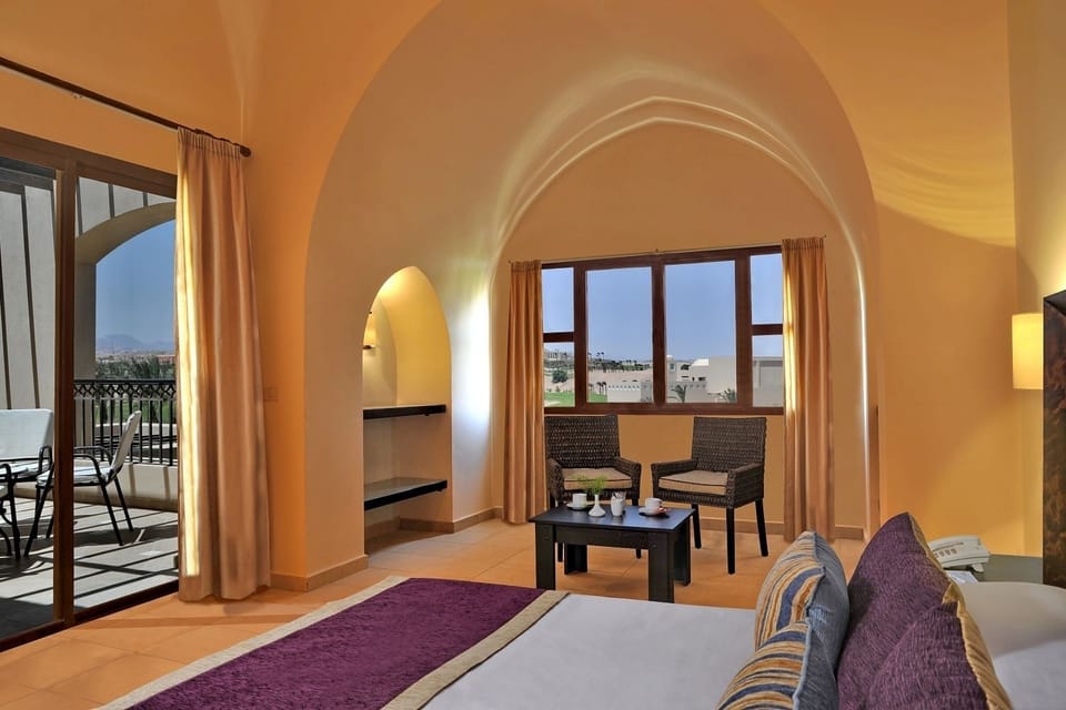 Relax in warm evening light with a quiet seating nook.