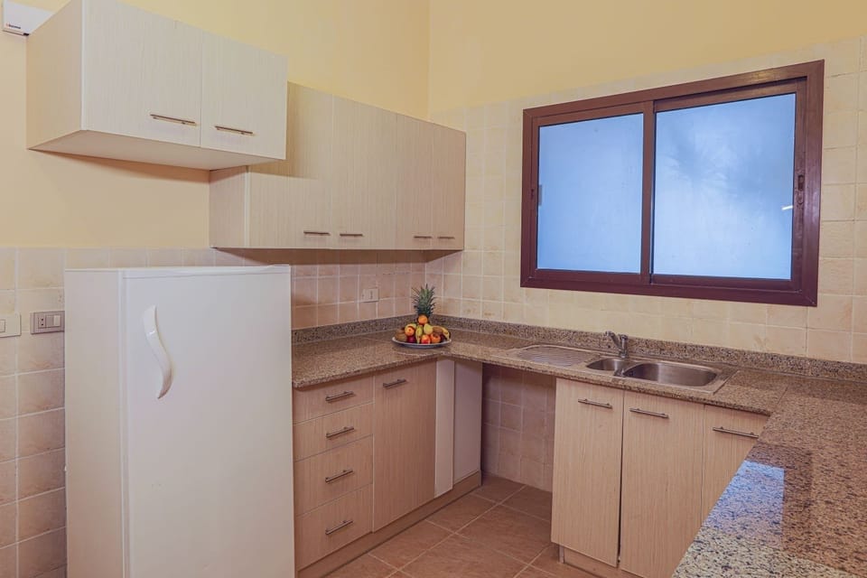 Cook simple meals in a clean kitchen with generous counters.