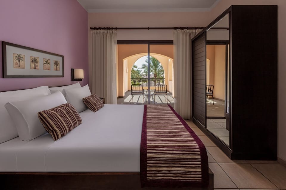 Sink into plush pillows and step onto your sunny balcony.
