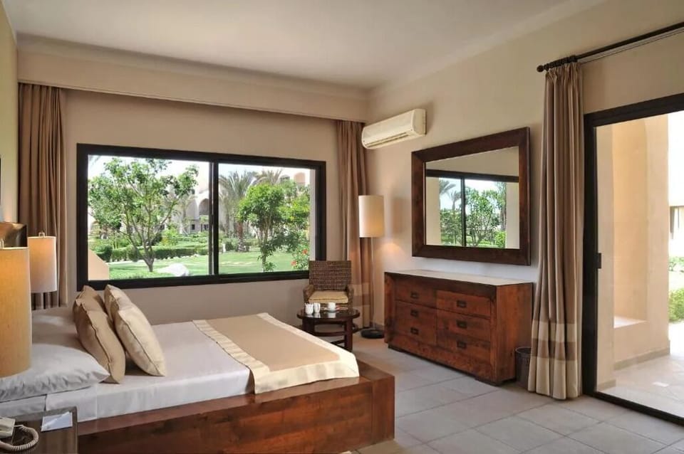 Relax in a serene bedroom with views and cool AC.