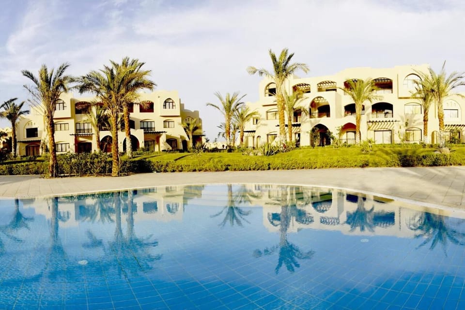 Soak up sunshine with palm-framed pool views and reflections.